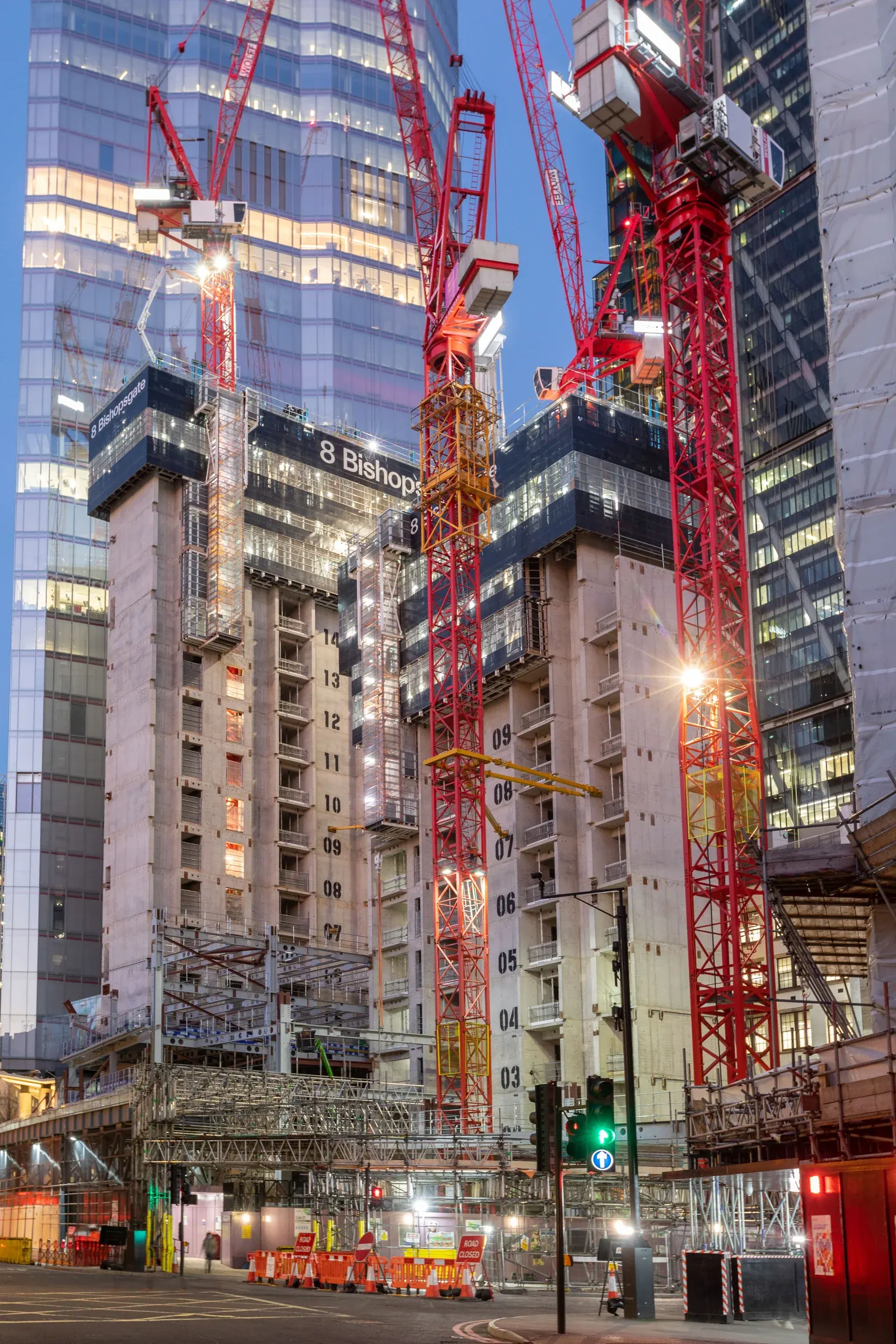 The cores and tower cranes at 8 Bishopsgate illuminated in the evening